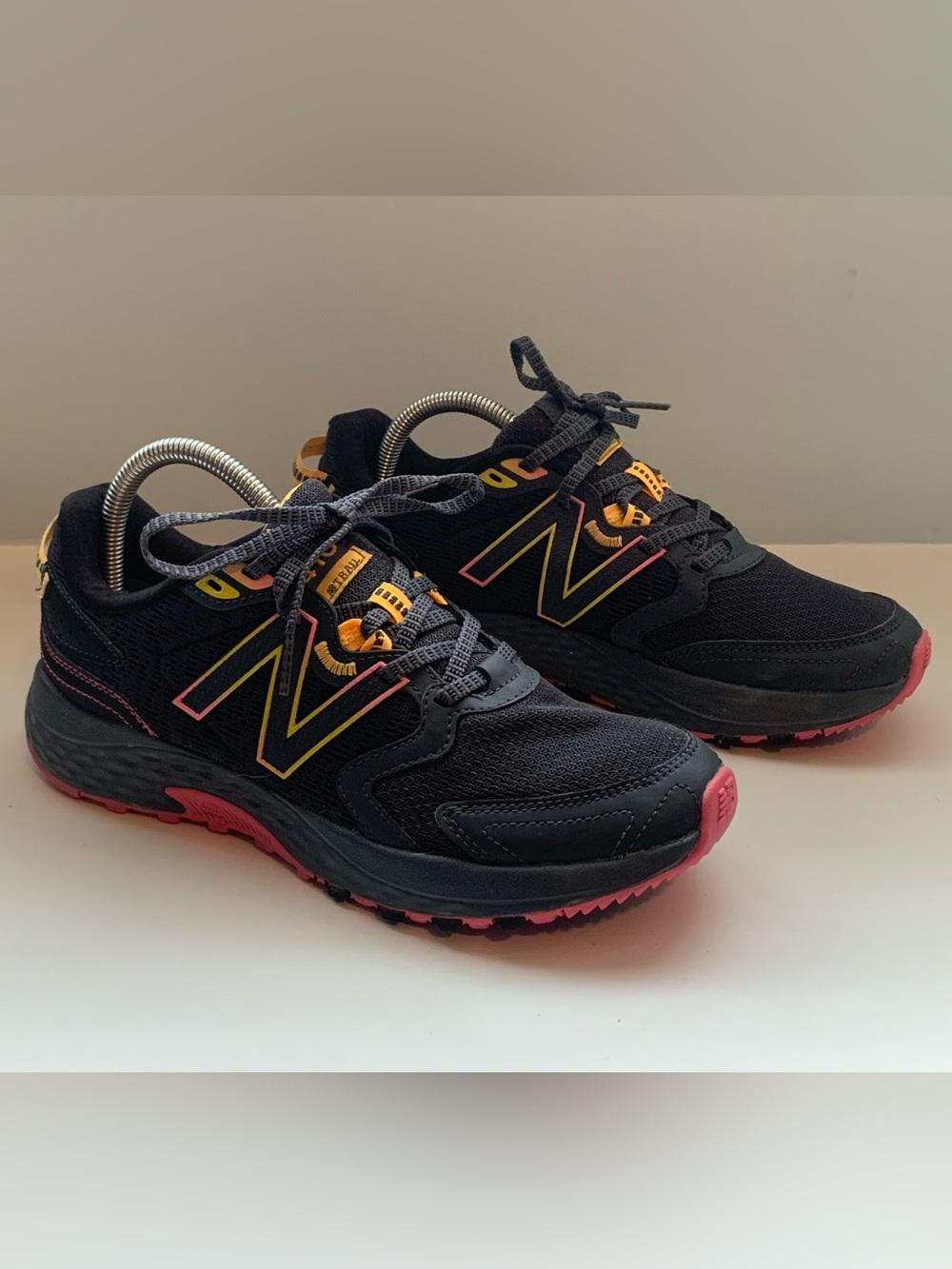 New Balance women’s Black & Pink Trail Sneakers
